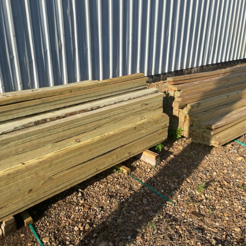 Lumber and supplies on display outside of Murfreesboro Hardware.