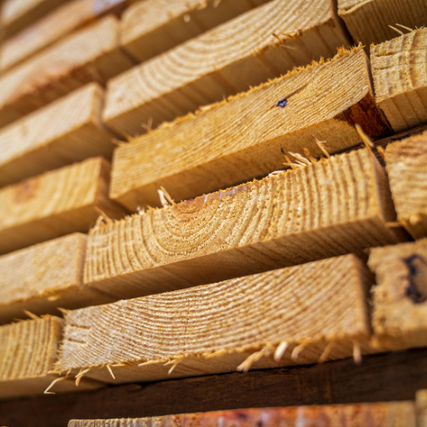 LumberStacked lumber boards.